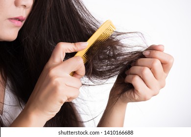 Healthy Concept. Woman Show Her Brush With Damaged Long Loss Hair And Looking At Her Hair.