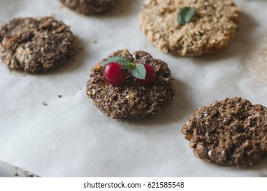healthy cookies with oat, flax seeds and dried apricots on a backing paper background