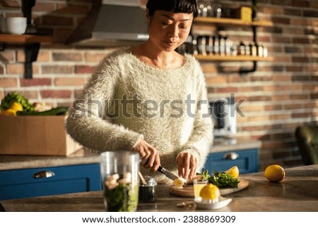 Healthy Cooking at Home: Woman Preparing Fresh Ingredients