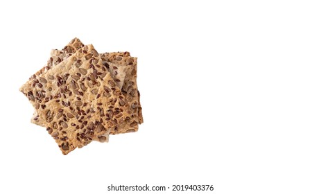 Healthy crackers with sunflower seeds and linseed seeds isloated on white. Top view, copy space
