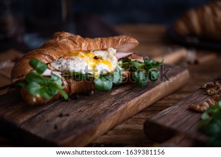 Healthy croissant for breakfast on dark background