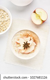 Healthy Diet Breakfast. Oats Porridge With Red Apple Slices And Cinnamon. Top View, Flat Lay