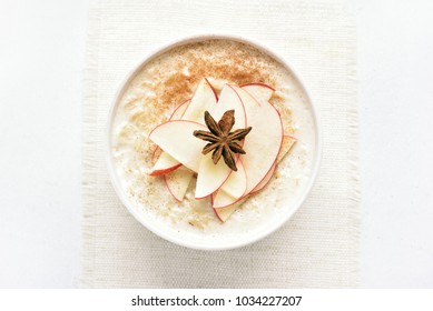 Healthy Diet Breakfast. Oats Porridge With Red Apple Slices And Cinnamon. Top View, Flat Lay