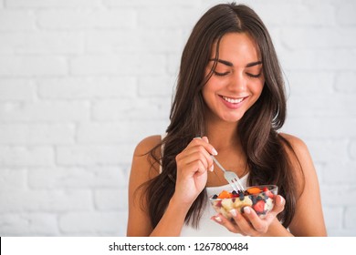 Healthy Diet Nutrition. Portrait Of Cheerful Girl Having Glass Of Natural Yogurt, Tasty Berries And Crunchy Muesli. Closeup Of Smiling Young Woman Eating Granola Fruit Parfait.