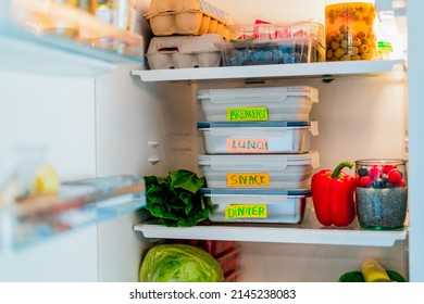 Healthy diet plan for weight loss, daily ready menu, lunch boxes cooked in advance and ready to be served for lunch, stand in fridge. Containers with eco friendly healthy food. Pre-cooking concept.