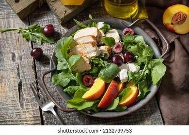 Healthy Diet Salad With Grilled Turkey, Arugula, Peach, Cherry, Feta And Vinaigrette Dressing On A Rustic Table. Keto Diet Lunch Menu.  