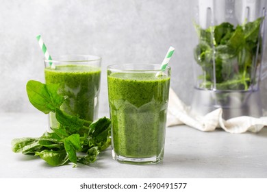 Healthy dieting and nutrition, lifestyle, vegan, alkaline, vegetarian concept. Green smoothie with organic ingredients, vegetables. Spinach smoothie.