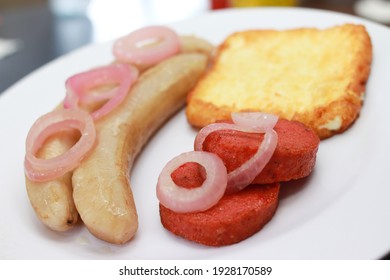 Healthy Dominican Breakfast, Guineitos With Fried Cheese, Salami And Onion