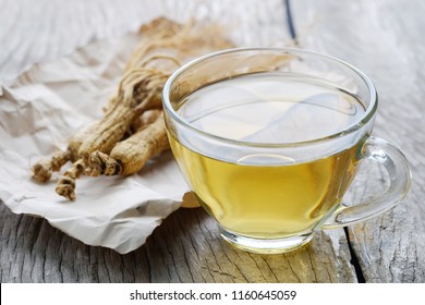 Healthy Drink Ginseng Tea On A Wooden Table.natural Medicine.