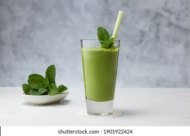 Healthy drink. Smoothies with banana, avocado, spinach, lime on a gray background. - Powered by Shutterstock