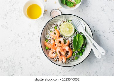 Healthy Easy Food. Wild Rice And Basmati Rice With Young Green Peas, Royal Prawns And Yellow Cherry Tomatoes In White Serving Bowl. Top View. Flatlay