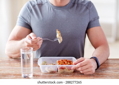 Healthy Eating, Balanced Diet, Food And People Concept - Close Up Of Male Hands Having Meat And Vegetables For Dinner With Fork And Water Glass