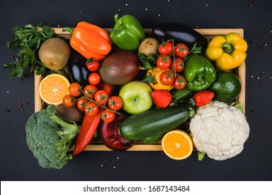 Healthy eating concept. Harvest Festival, Thanksgiving. Fresh food. Diet for weight loss. Flatlay, layout, view top. Food supply. Delivery of eco-bio- mixed products in a tray. Black background. - Shutterstock ID 1687143484