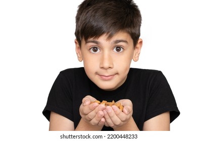 Healthy Eating, Dieting, Vegetarian Food Concept. Close Up Of Kid Hands Holding Peeled Almond On White Background.