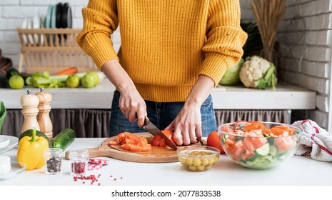 Healthy Eating. Front View Of Female Hands Making Salad Cutting Tomatoes In The Kitchen