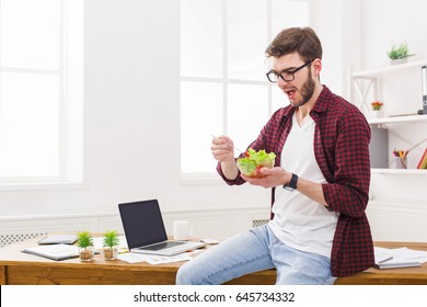 Healthy Eating In Office, Man Has Lunch With Fresh Salad, Copy Space