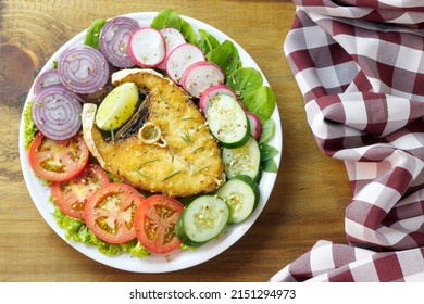 Healthy Eating Plate Of Grilled Fish And Vegetable Salad Over Rustic Wooden Table. Ketogenic And Paleolithic Diet. Top View