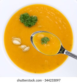 Healthy Eating Pumpkin Soup With Fresh Pumpkins On Spoon From Above