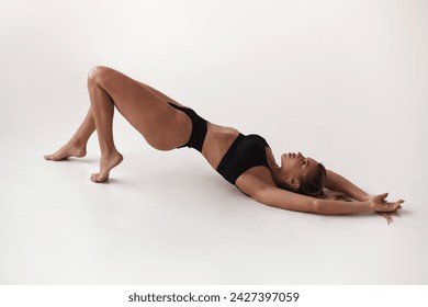 Healthy eating, sports for weight loss. Happy young blonde woman showing a perfect slim body on a white studio background, collage with outlines of an aesthetic figure - Powered by Shutterstock