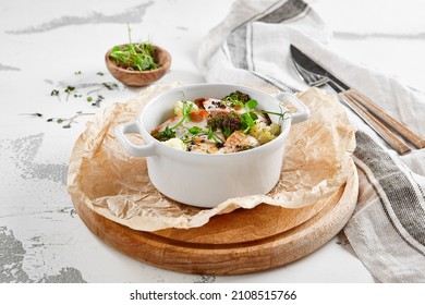 Healthy eating: steamed vegetables with salmon. Healthy salmon meal with broccoli and cauliflower. Casserole with fish and broccoli for lunch. Broccoli dish in diet menu. Cooked fish and veggies - Shutterstock ID 2108515766