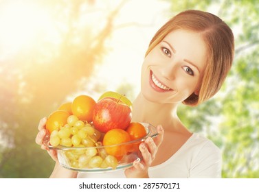 Healthy Eating. A Woman With A Plate Of Fruit In The Summer On The Nature