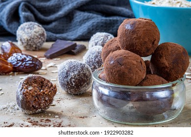 Healthy Energy Protein Balls With Dates, Oats, Peanut Butter And Dark Chocolate. Homemade Gluten Free Truffle Bites Covered With Cocoa Powder Or Almonds. Vegan Raw Appetizer Or Food Snack. Side View.