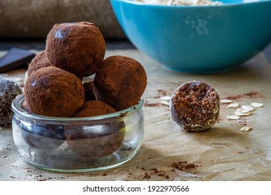 Healthy Energy Protein Balls With Dates, Oats, Peanut Butter And Dark Chocolate. Homemade Gluten Free Truffle Bites Covered With Cocoa Powder Or Almonds. Vegan Raw Appetizer Or Food Snack. Side View.