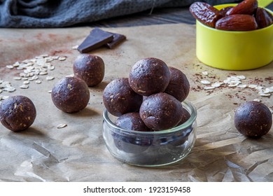 Healthy Energy Protein Balls With Dates, Oats, Peanut Butter And Dark Chocolate. Homemade Gluten Free Truffle Bites With No Bake. Vegan And Vegetarian Raw Appetizer Or Food Snack. Side View