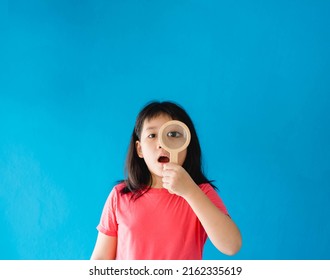 Healthy Eyes And Vision.Portrait Happy Asian Kid Child Holding Magnifying Glasses On Eyes.Smiling Girl With Healthy Skin.Surprise Sale. Eye Care.Carotene Vitamin.Focus, Optician Doctor, Optical.