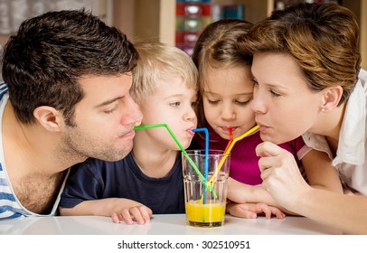 Healthy Family Drinking Fresh Orange Juice