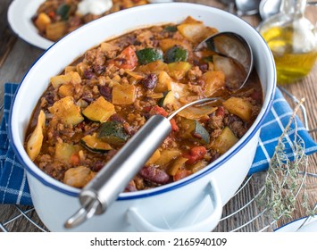 Healthy Family Meal With A Minced Meat Stew, Cabbage, Vegetables And Kidney Beans. Served In Pot On Kitchen Table