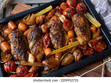 Healthy family meal with oven roasted chicken breast and vegetables on a baking tray - Powered by Shutterstock