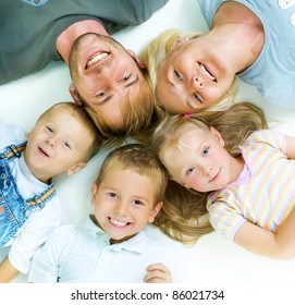Healthy Family. Parents with three kids having fun together