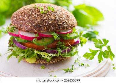 Healthy Fast Food. Vegan Rye Burger With Fresh Vegetables On White Wooden  Background