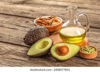 Healthy Fat avocado oil nuts on a wooden background. top view, omega 3, Vegan food, - Powered by Shutterstock