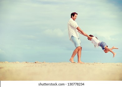 Healthy Father And Daughter Playing Together At The Beach Carefree Happy Fun Smiling Lifestyle