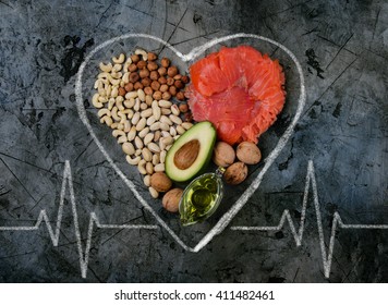 Healthy Fats For Heart On Dark Stone Background. Concept.