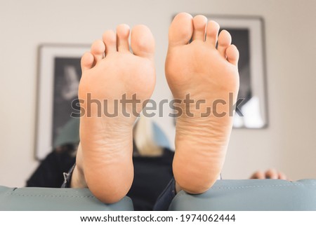 Healthy feet of a young woman. Landscape format. Foot care.