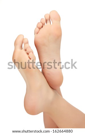 Healthy female feet, white background, copyspace