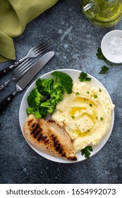 Healthy And Filling Dinner With Grilled Chicken Breast, Mashed Potatoes And Broccoli Overhead Shot