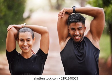 Healthy, Fit And Motivated Couple Stretching, Warming Up Or Training Together In Green Park With Bokeh Background. Faces Of Athletic Man And Woman Preparing For Endurance Workout, Warmup Or Exercise