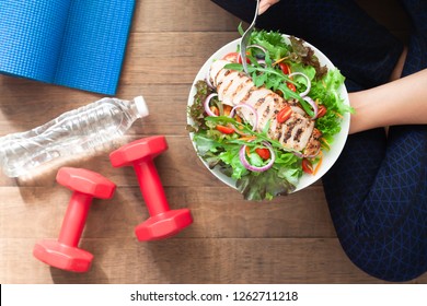 Healthy And Fitness Food. Chicken Salad Dish With Fitness Equipments