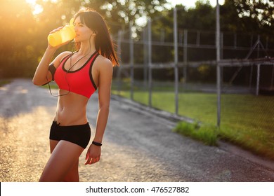 Of Healthy Fitness Girl Drinking Protein Shake. Woman Drinking Sports Nutrition Beverage While Working Out