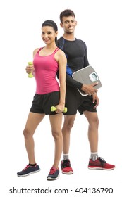Healthy fitness people with a weight scale and dumbbell on white background.