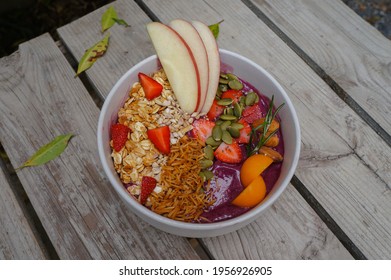 Healthy Food Acai Breakfast Superfoods Smoothie Bowl With Chia Seeds, Bee Pollen, Fresh Strawberry, Apple, Almond And Granola For Healthy Vegan