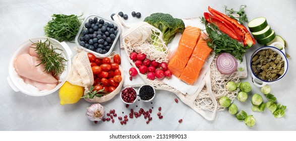 Healthy food assortment on light background. Clean eating concept. Flat lay, top view, panorama