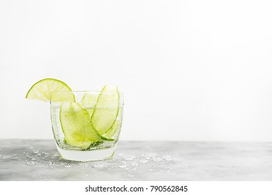 Healthy Food Background: Cucmber And Lime Detox Soda Water. Vegetarian Food Concept. Text Space