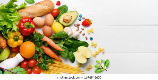 Healthy food background. Food photography different fruits and vegetables on white wooden table background. Copy space. Shopping food in supermarket - Powered by Shutterstock
