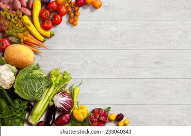 Healthy food background / studio photo of different fruits and vegetables on wooden table 
