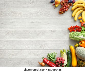 Healthy food background. Studio photo of different fruits and vegetables on white wooden table. High resolution product. - Powered by Shutterstock